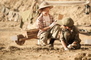 'children playing in dirt'