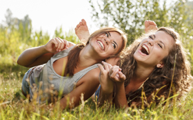 Smiling girls will get a wisdom tooth extraction in Cupertino when they get older.