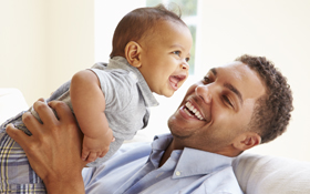 Man playing with child had his wisdom teeth pulled at a young age by an oral surgeon in Cupertino.