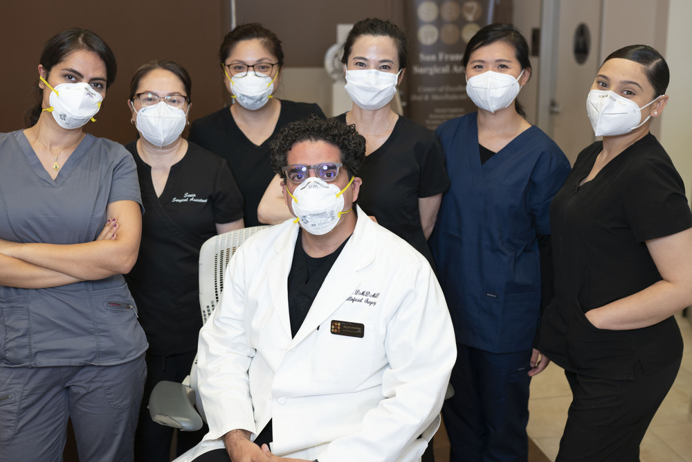Silicon Valley oral surgeon Dr. Massoomi and his staff wearing masks to protect patients from COVID.